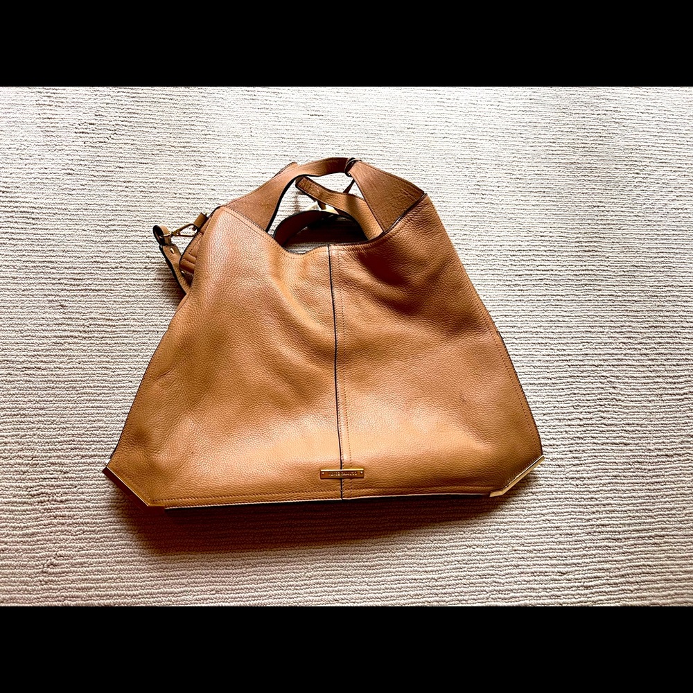Vince Camuto camel colored leather hobo bag.